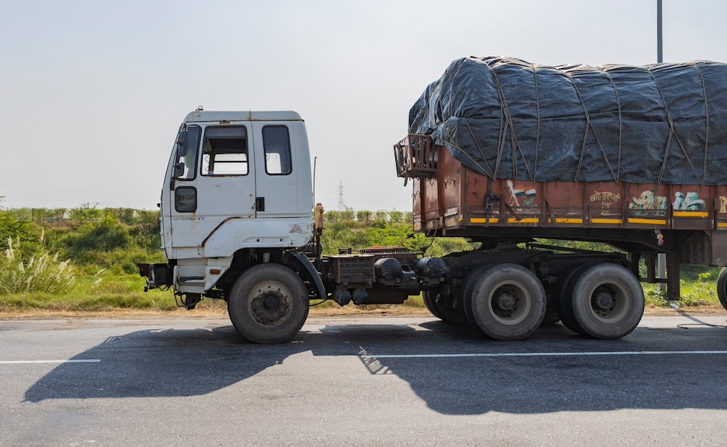 indian truck on deeg hihgway under bright sky