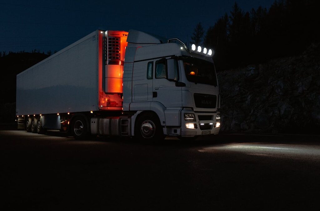 photo of white truck with red lights